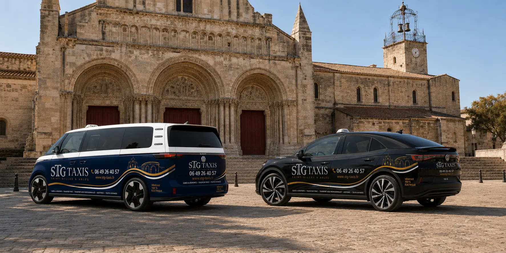 Les deux véhicules STG Taxis devant l’abbatiale de Saint-Gilles